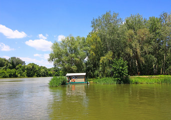 Little house next to the river Tisza