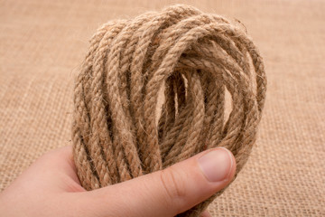 Bundle of linen rope  in hand