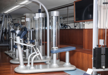 Interior of modern gym with machines