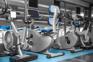 Interior of modern gym with machines