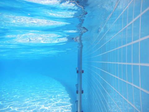 Modern swimming pool with stairs underwater