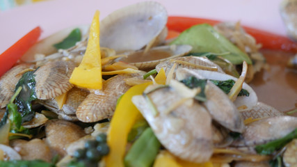 Close up of thai cuisine stir-fried clams with curry or stir fried clams with roasted chili paste