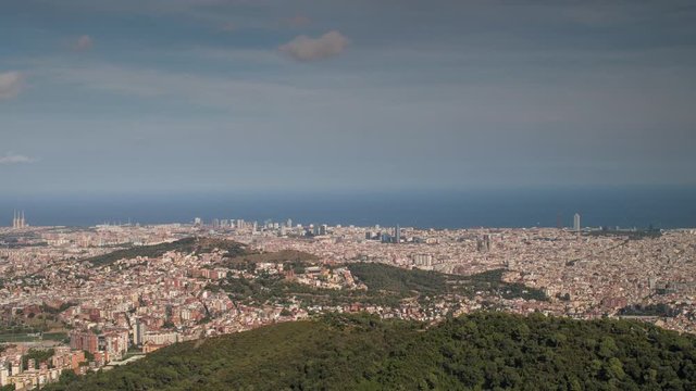 timelpase of the barcelona city skyline in the afternoon with beautiful light