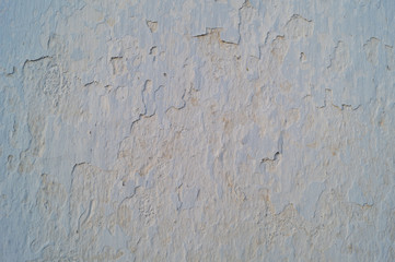 Old cracked wall covered grey plaster, background, texture