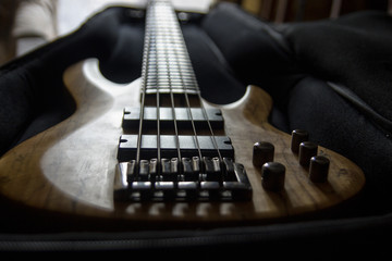 Fototapeta na wymiar Bass guitar in the case, close up