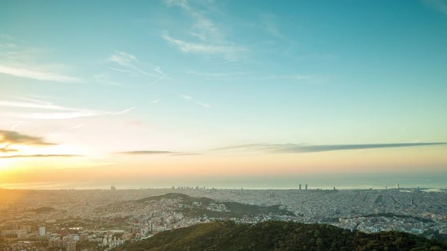 sunrise timelapse of the barcelona city skyline with beautiful light