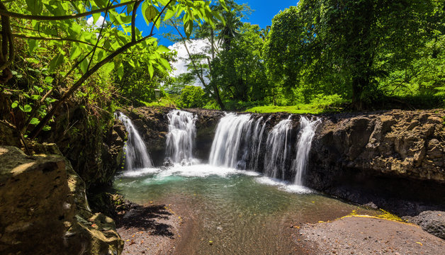 Vibrant Togitogiga Falls With Swimming Hole On Upolu, Samoa.