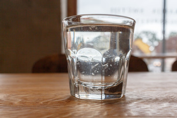 A glass of water on the table in the restaurant