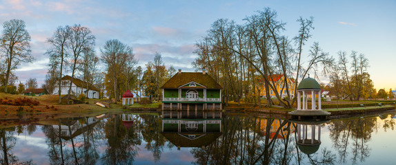 Manor with a pond, bathhouse and rotunda at sunrise. Palmse, Estonia.