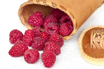 Raspberries in birch bark basket