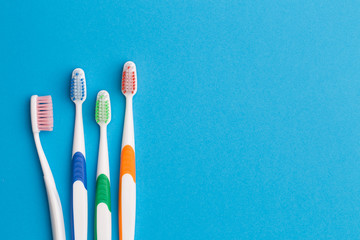 Colorful toothbrushes, space for text