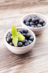 Freshly picked blueberries in wooden bowl. Juicy and fresh blueb