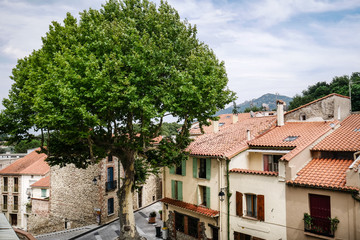 Typical traditional catalan village in south of France with typical houses with colored windows