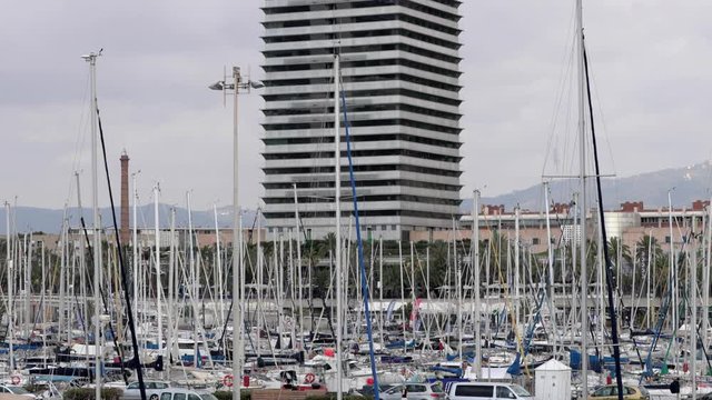 view of the yachts and twin towers in Port Olympic, Barcelona