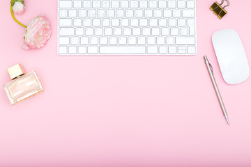 Feminine things and accessories on a pink background