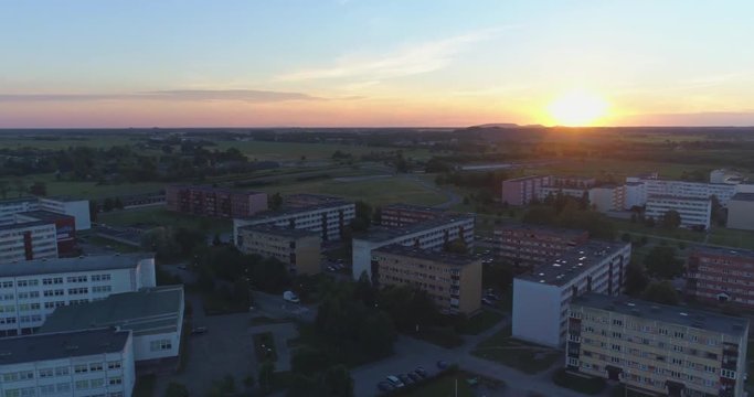 Aerial view of residential neighborhoods at sunset. Aerial hyperlapse footage.