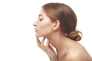 Beautiful woman cares for the skin neck
