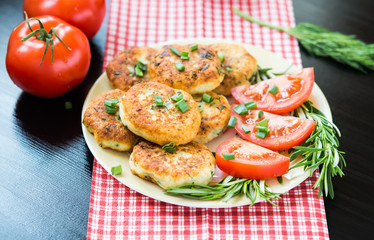 Homemade Salty Cottage Cheese Pancakes with rosemary and dill. Tomatoes