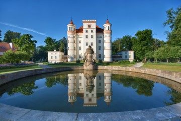 Fountain in a garden surrounding neo-Gothic style palace in Wojanow, Poland - obrazy, fototapety, plakaty