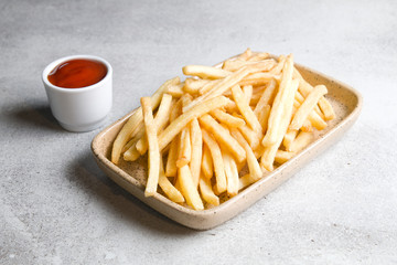 French fries on gray background