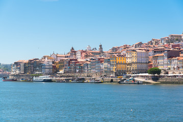 Fototapeta na wymiar Porto in Portugal, view of the river Douro and the city, with typical colorful houses 