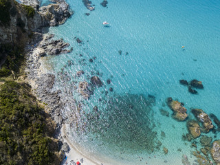 Fototapeta na wymiar Paradiso del sub, spiaggia con promontorio a picco sul mare. Zambrone, Calabria, Italia. Immersioni relax e vacanze estive. Vista aerea