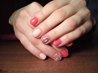 The manicurist excellently made her work a beautiful manicure with a polish gel on her hands and the client is happy