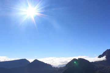 Sun above mountains