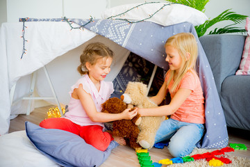 Kids in a wigwam © Nichizhenova Elena