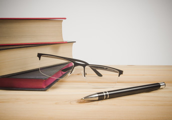 Book with glasses, education concept.