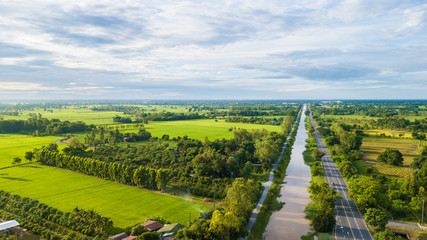 Aerial view of Fields with various types of agriculture and Irrigation canal in rural Thailand