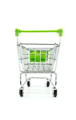 Green miniature shopping cart isolated on white