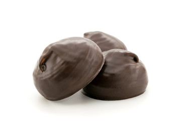 Three marshmallows in chocolate closeup