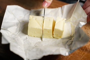 slicing butter brick with knife