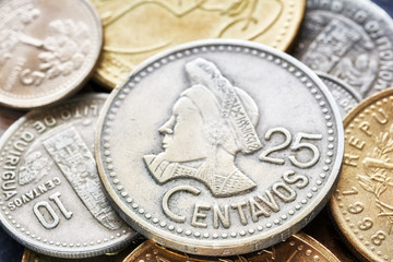 Extreme close up picture of Guatemalan quetzal coins, shallow depth of field.
