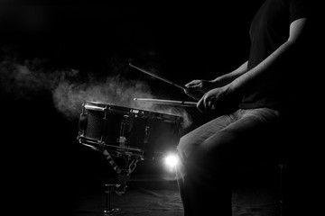 The man is playing snare drum.