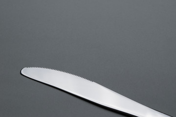 Cutlery on gray background.