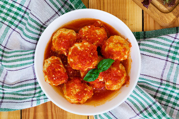 Meatballs on wooden background
