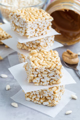 Homemade bars with crispy rice, honey and peanut butter, vertical