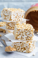 Homemade bars with crispy rice, honey and peanut butter, vertical