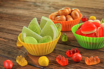 Composition with tasty candies on table
