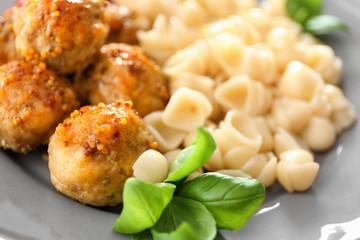 Plate with turkey meatballs and pasta, closeup