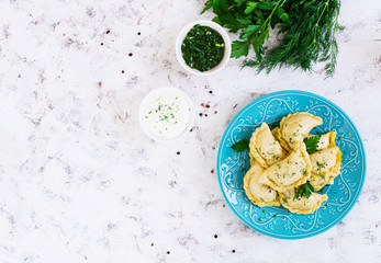 Delicious dumplings with cabbage on white background