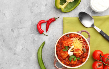 Casserole with delicious chili turkey on napkin