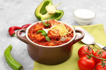 Casserole with delicious chili turkey on napkin