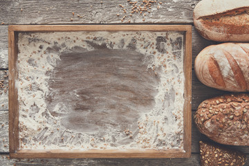 Bread bakery background. Brown and white wheat grain loaves comp