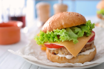 Tasty turkey burger on table