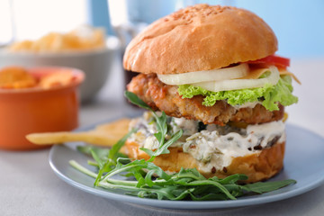 Tasty turkey burger on table