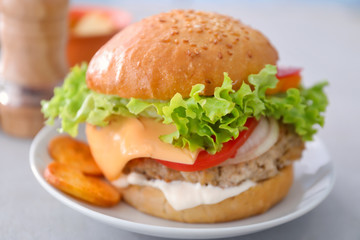 Tasty turkey burger on table, close up