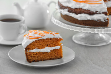 Delicious carrot cake on table